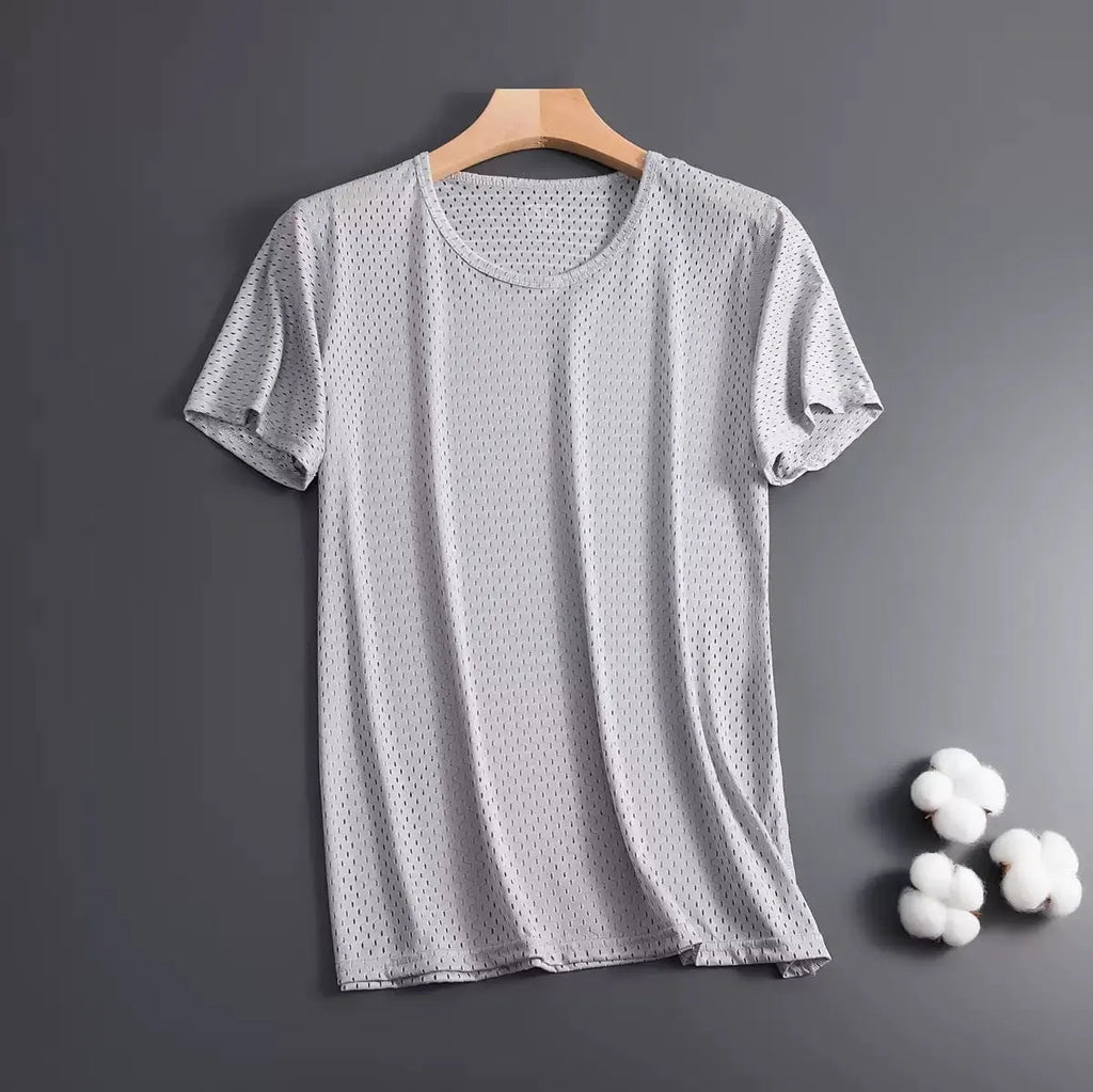 Man wearing a grey ice silk mesh short sleeve crew neck t-shirt with a loose fit.