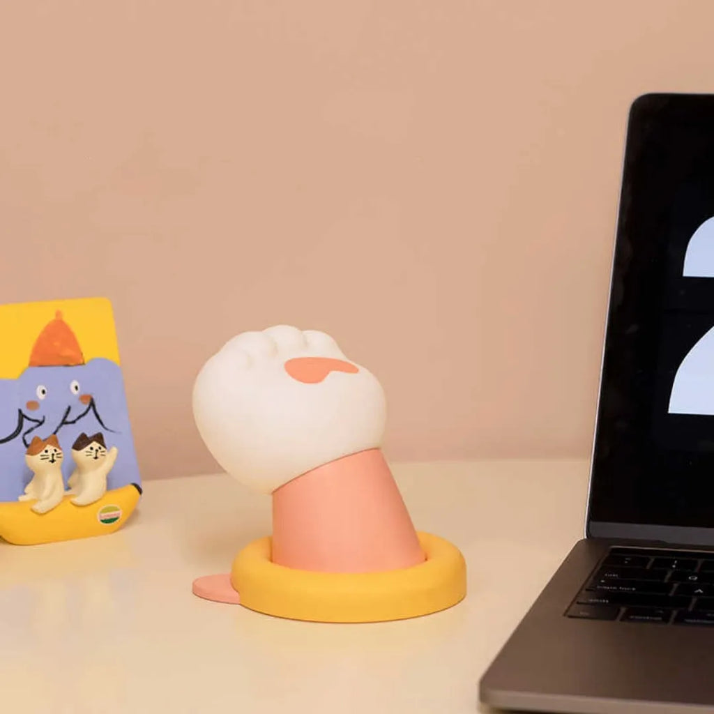 Cat paw desk lamp with outstretched claw design showing tap control and adhesive back