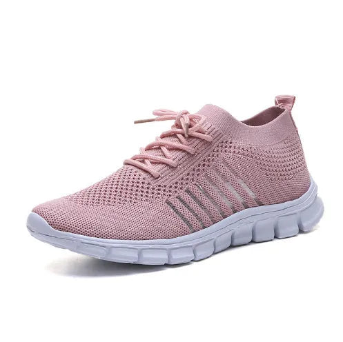 Women's breathable lace-up sneaker in a low-top style with a flat rubber sole.