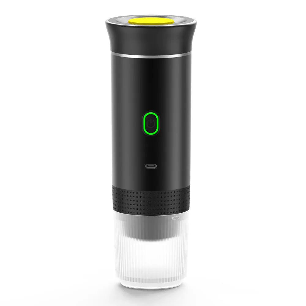 Portable electric espresso machine in grey with USB charging cable, shown next to coffee capsules