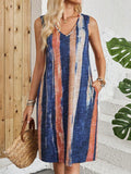 Casual women's sleeveless V-neck dress with striped colour block pattern in midi length.