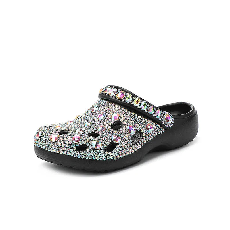 Black women's platform sandals with rhinestone decoration and a perforated slider design.