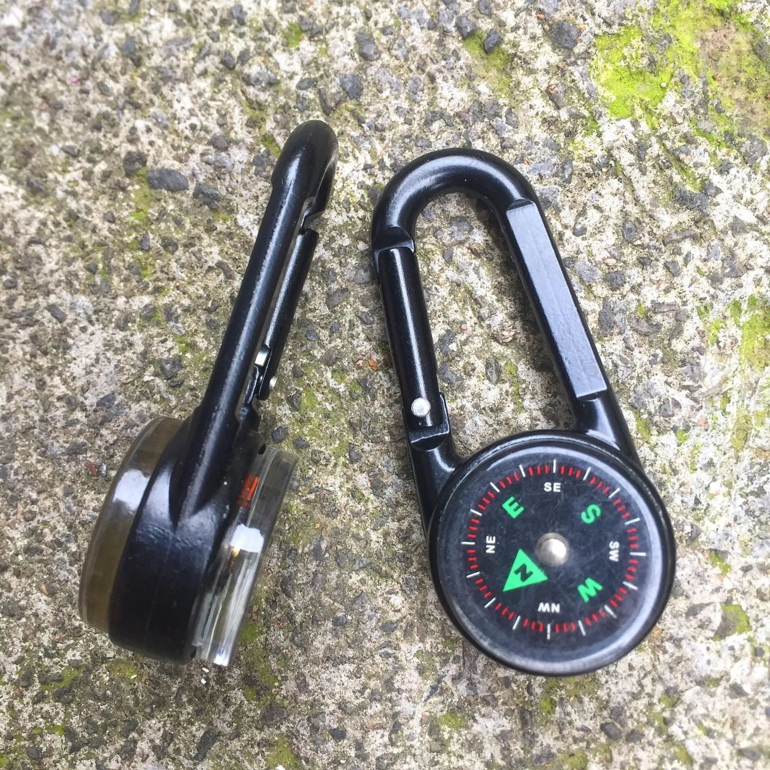 Black zinc alloy outdoor carabiner with integrated compass and thermometer display.