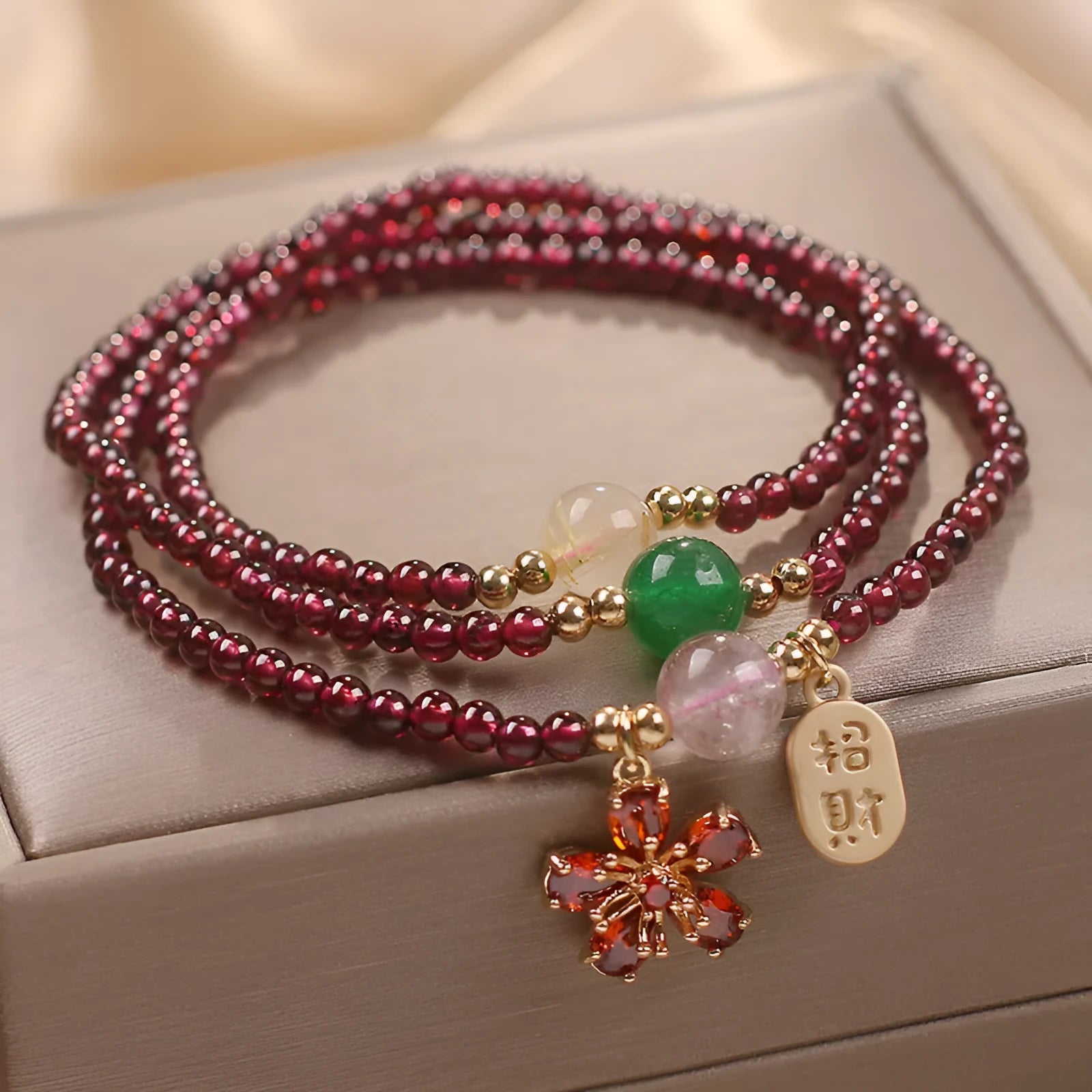 Natural crystal bracelet in pomegranate red and cherry blossom colours with sequin bead accents for women