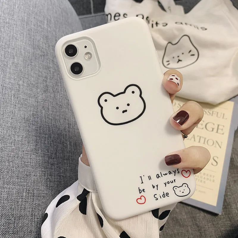 Silicone mobile phone case with a cartoon bear design for Apple iPhone models.
