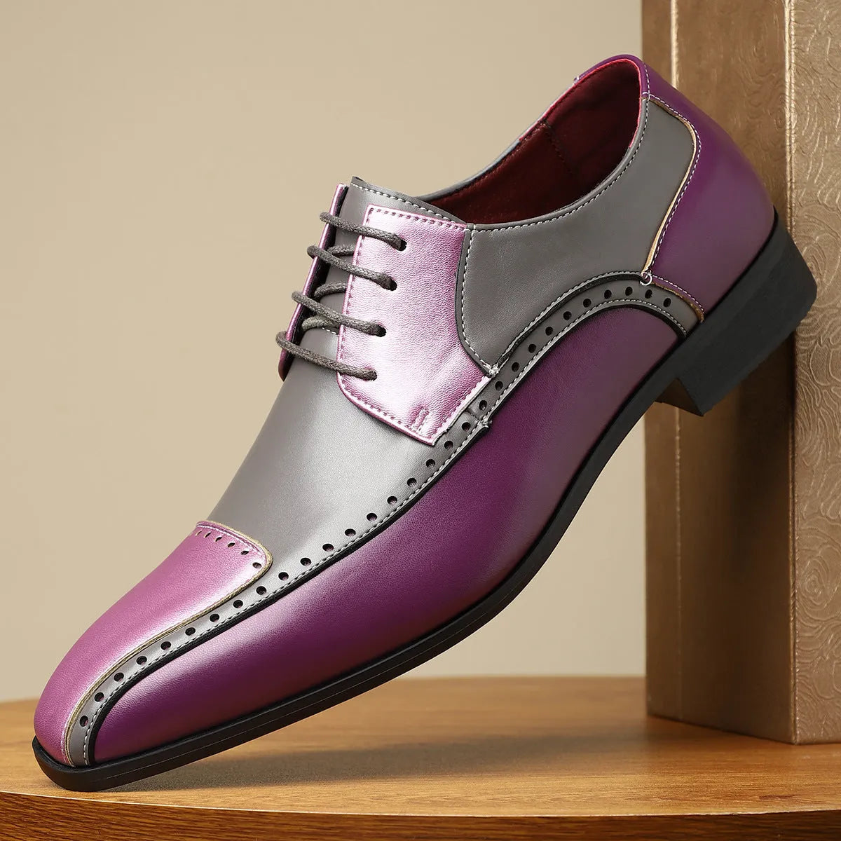 Men's low-top leather shoes in black, green, or purple with stitching detail and a leather toe cap.