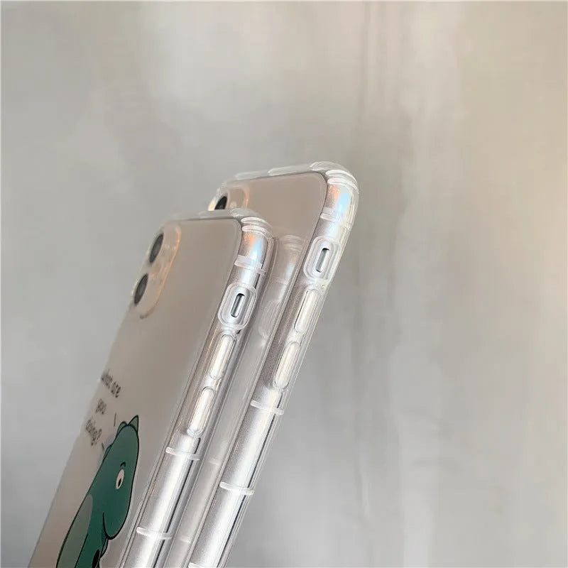 Transparent airbag shockproof mobile phone case for iPhone with green dinosaur design on clear back.