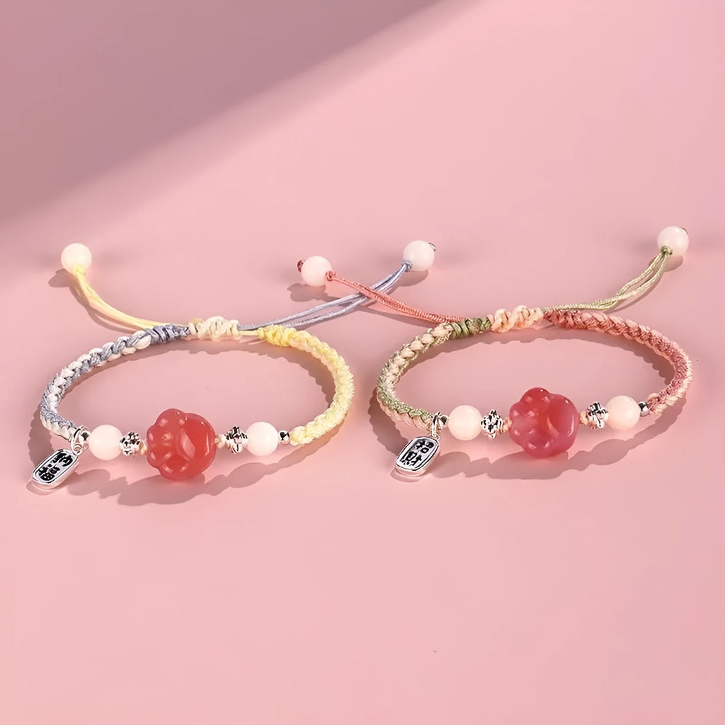 Red cat's paw charm couple bracelet in pastoral woven style with pink or yellow options