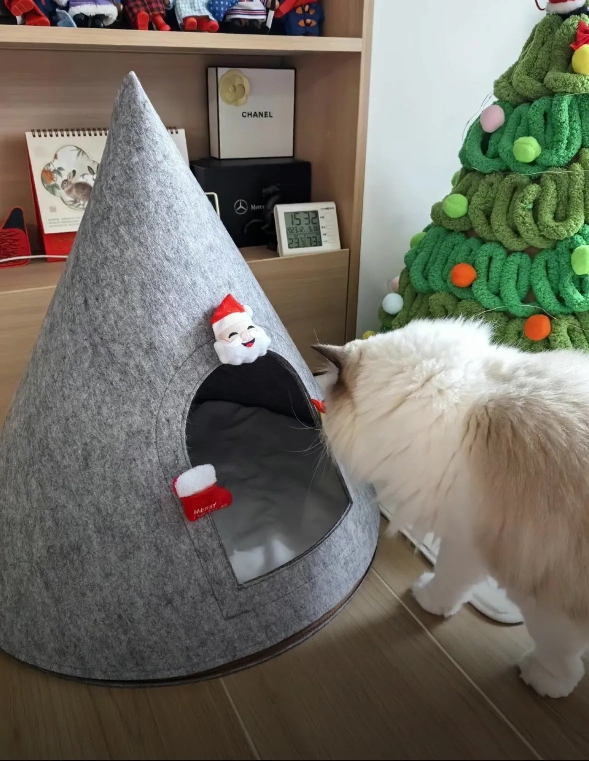 Grey conical felt cat house tent with circular base for indoor use