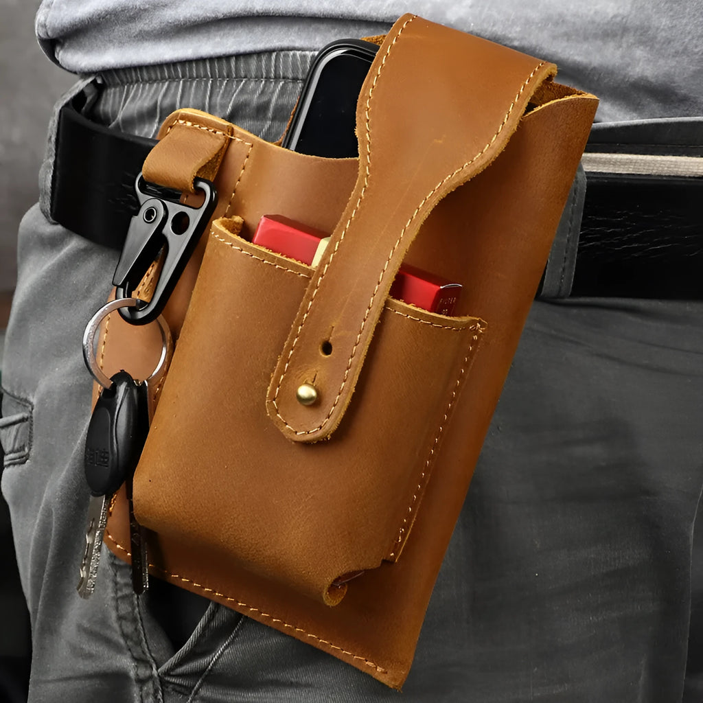 Men's brown leather belt bag with car stitching, shown attached to a belt with phone inside.