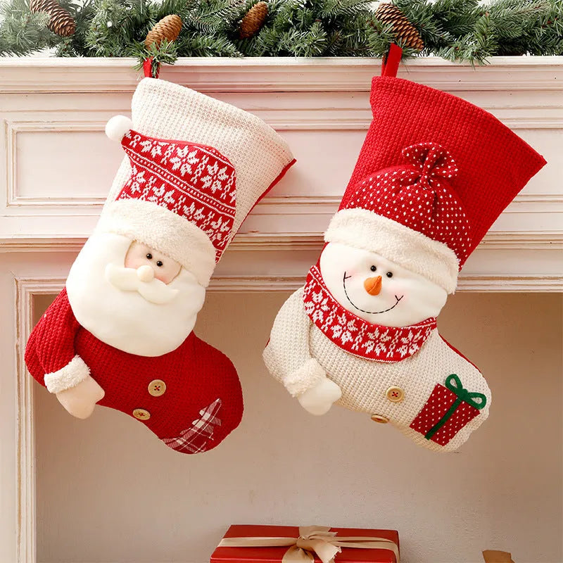 Large red and white knitted Christmas stocking with Santa Claus design for fireplace decoration