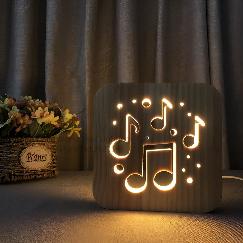 Natural pine wood cube LED atmosphere lamp with warm white glow on a desk.
