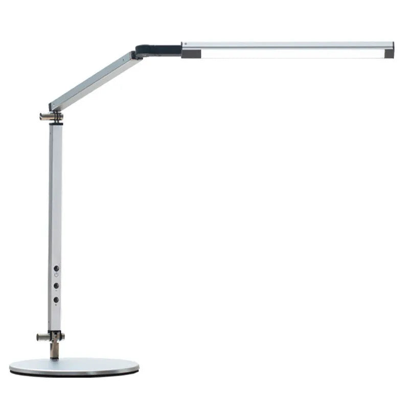 Aluminium clip-on desk lamp with adjustable arm and remote control on a wooden desk.