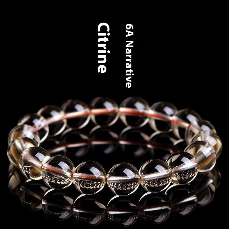 Natural citrine scattered beads ball bracelet on a wrist, showing polished stones in a choice of colours and sizes.