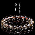 Natural citrine scattered beads ball bracelet on a wrist, showing polished stones in a choice of colours and sizes.