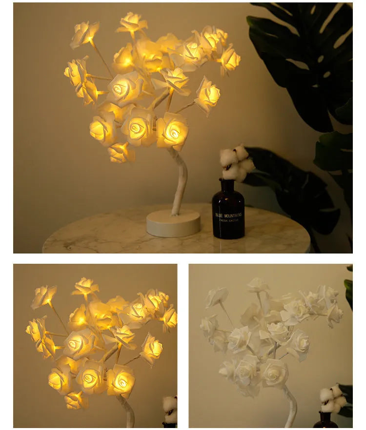 White and red rose shaped LED table lamp with bonsai tree base on a wooden table.