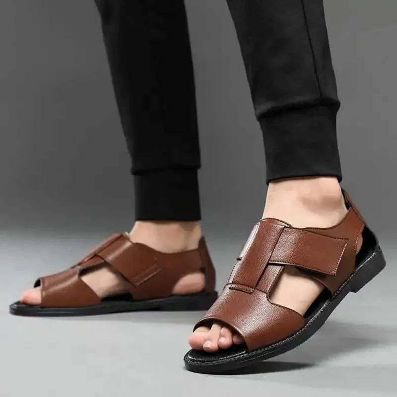 Men's black and brown open-toe leather sandals with a textured rubber sole.