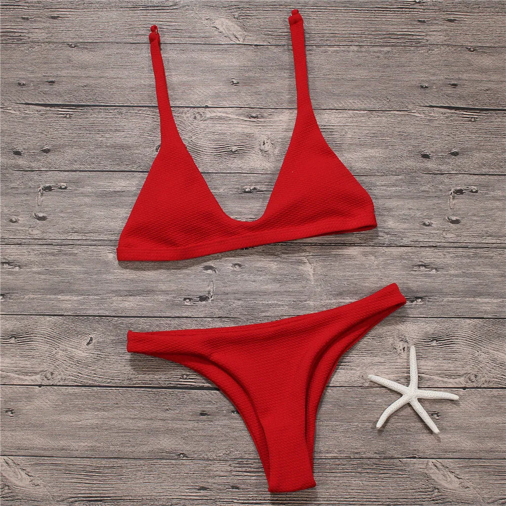 Women's solid low waist bikini set in black with padded wire-free top and stretch fabric