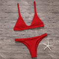 Women's solid low waist bikini set in black with padded wire-free top and stretch fabric