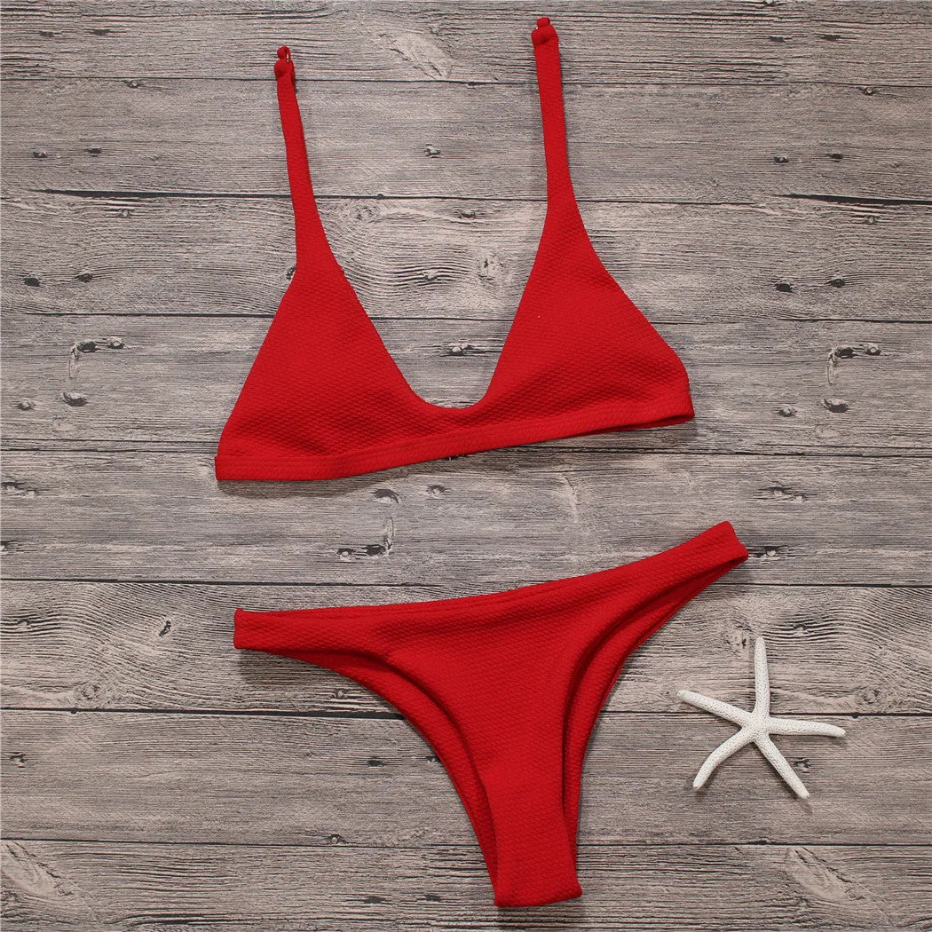 Women's solid low waist bikini set in black with padded wire-free top and stretch fabric