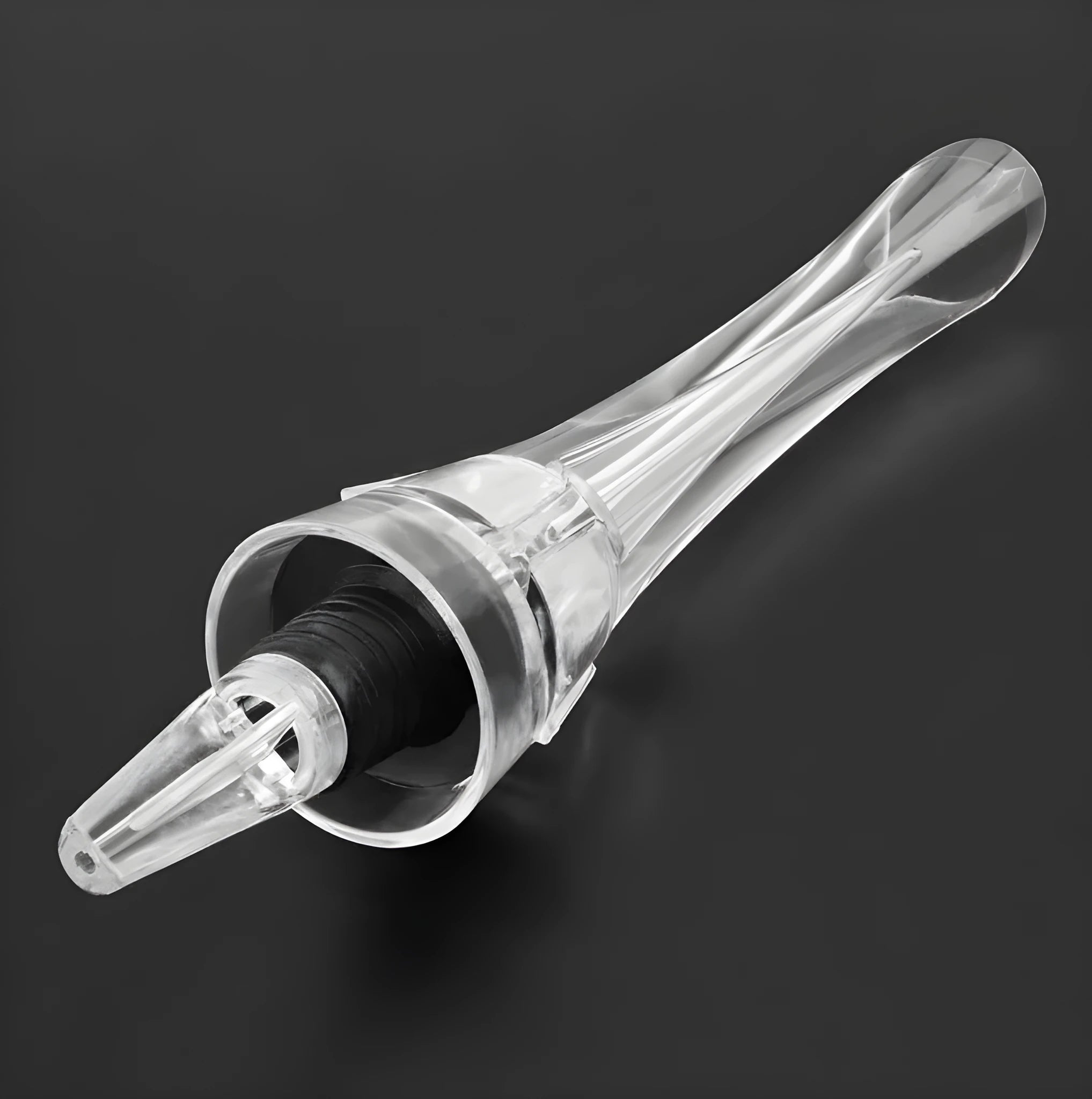 Clear acrylic wine aerator with stainless steel filter, shown next to a wine glass.
