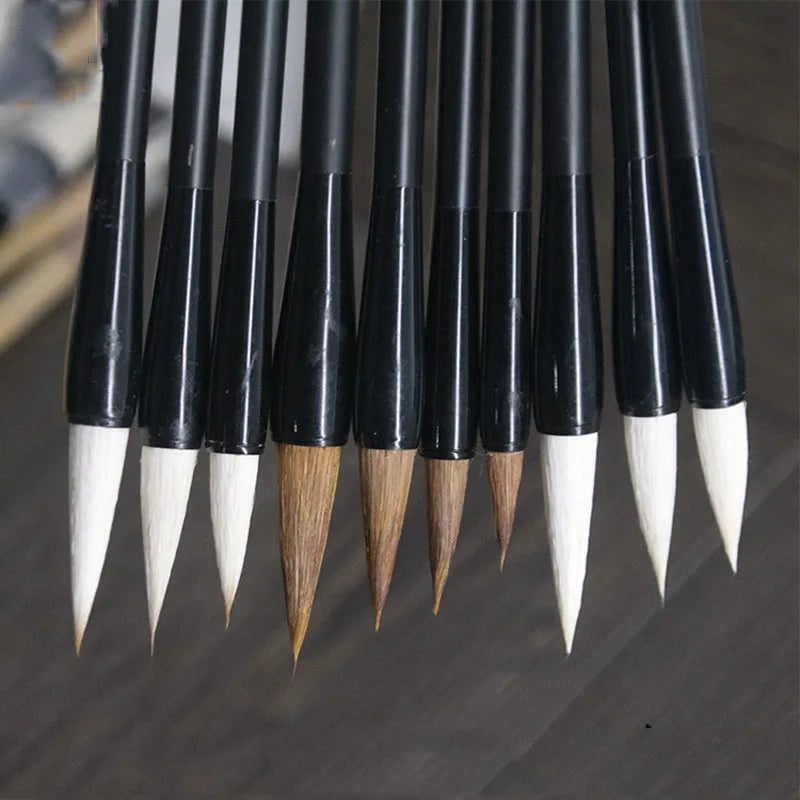 Student calligraphy brush with steel handle, showing kanhao nib and natural hair bristle options.