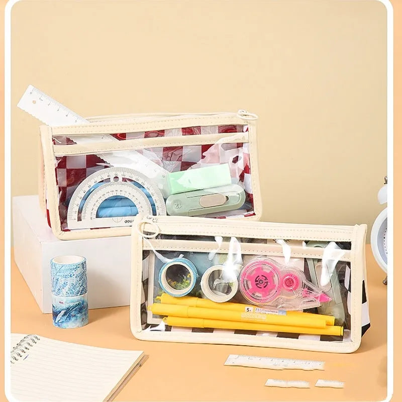 Transparent PVC pencil case with chessboard pattern, showing pens inside, dimensions 21.5cm by 8cm by 11.5cm