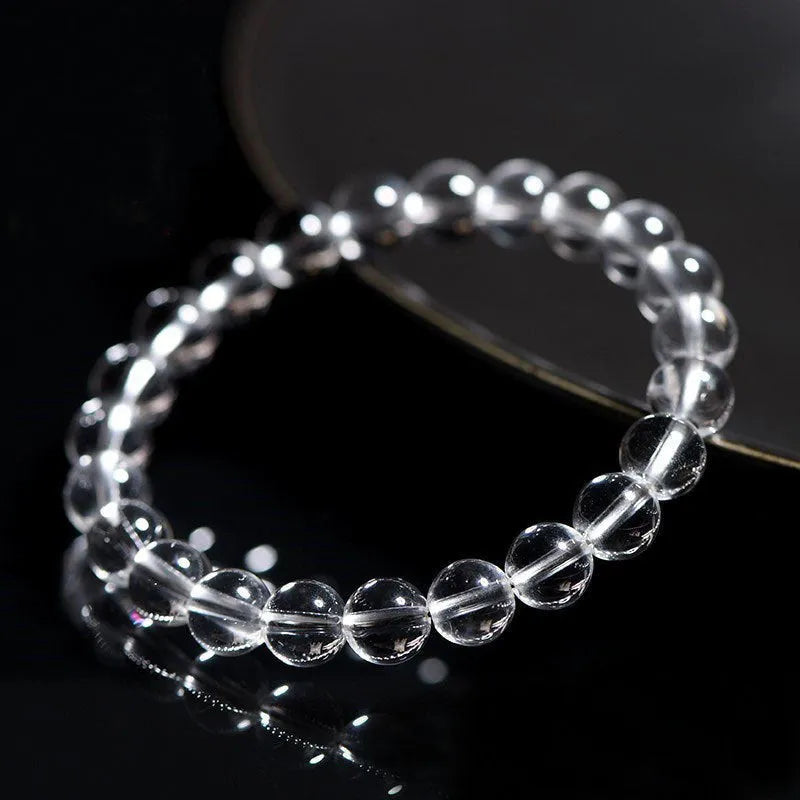 White crystal bracelet with round beads in various sizes from 6mm to 14mm diameter