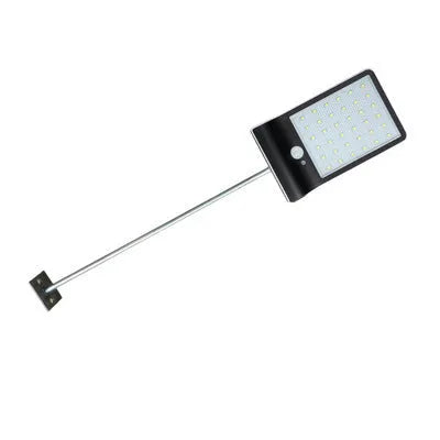 Black and white outdoor solar-powered garden light with LED illumination for pathways.