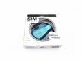 A blue external USB SIM card reader for mobile phones on a flat surface.