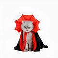 Small dog wearing black vampire cloak Halloween costume with three size options displayed