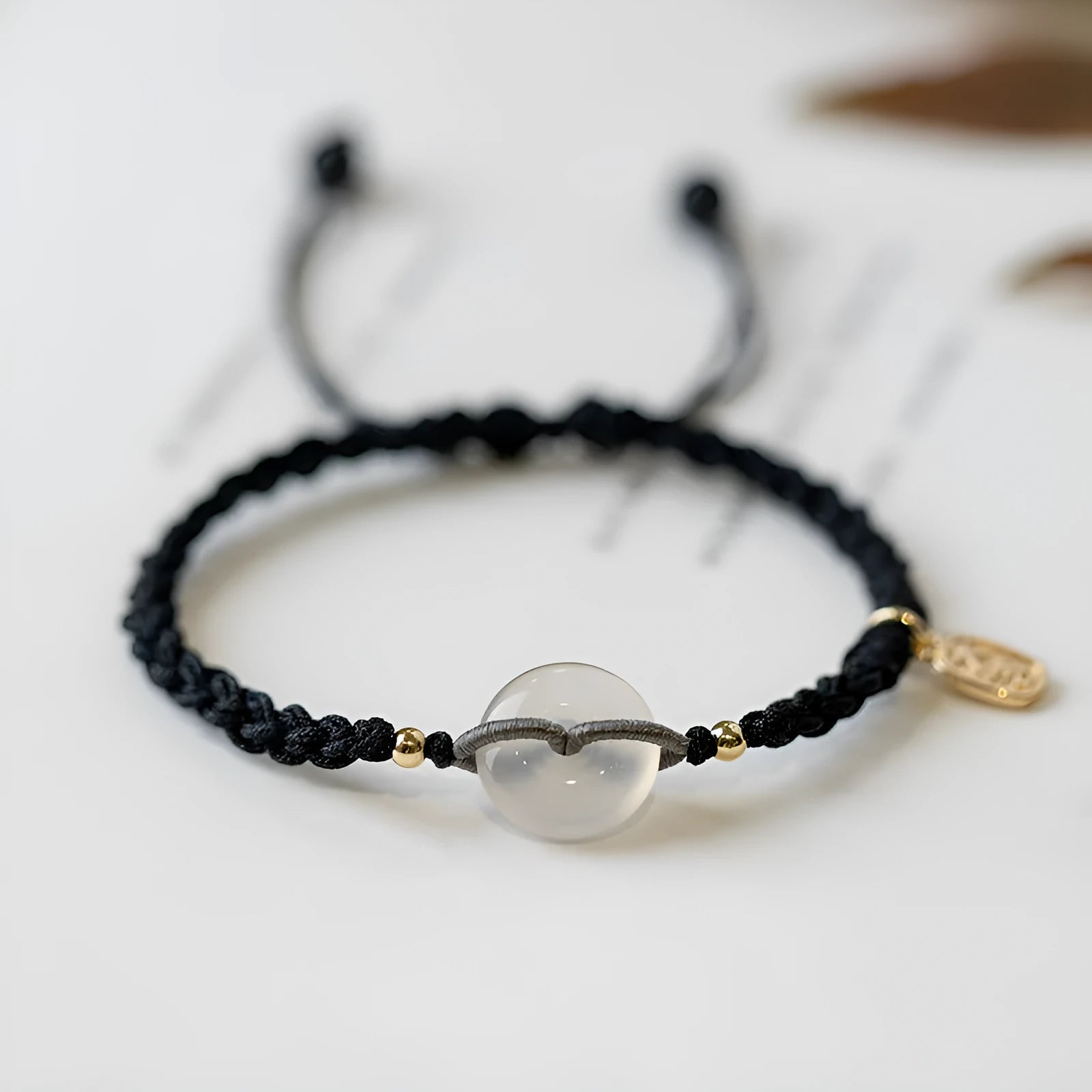 Ethnic-style women's crystal bracelet with woven rope strap and flower-shaped centrepiece