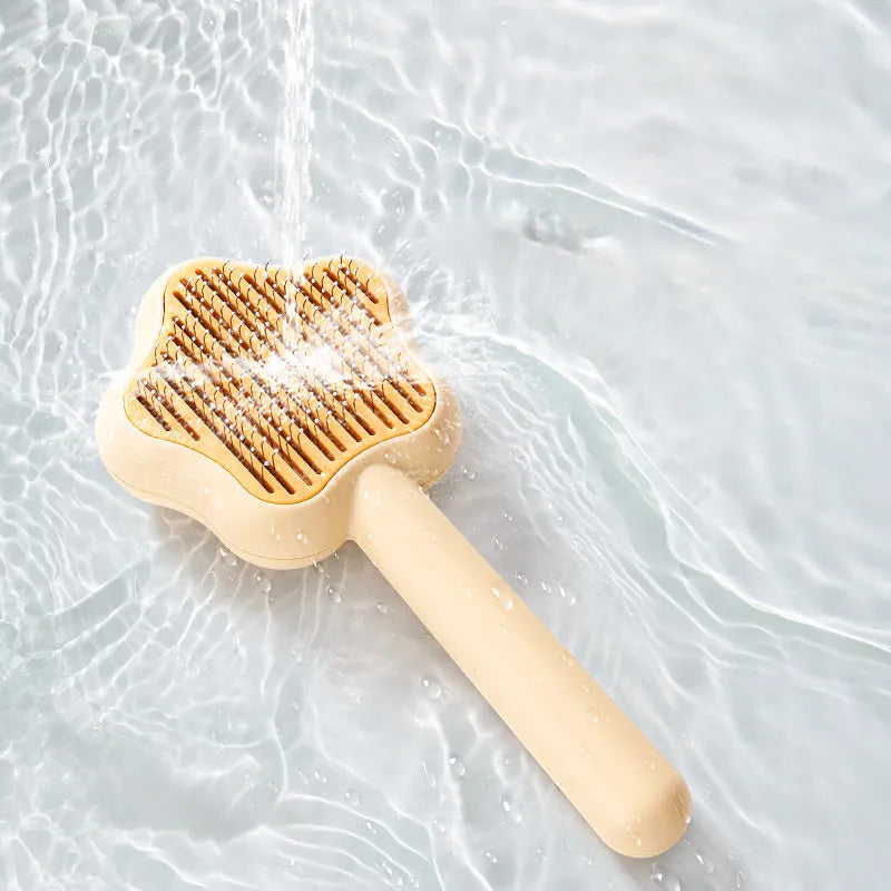 Green or yellow self-cleaning stainless steel cat comb measuring 20cm long