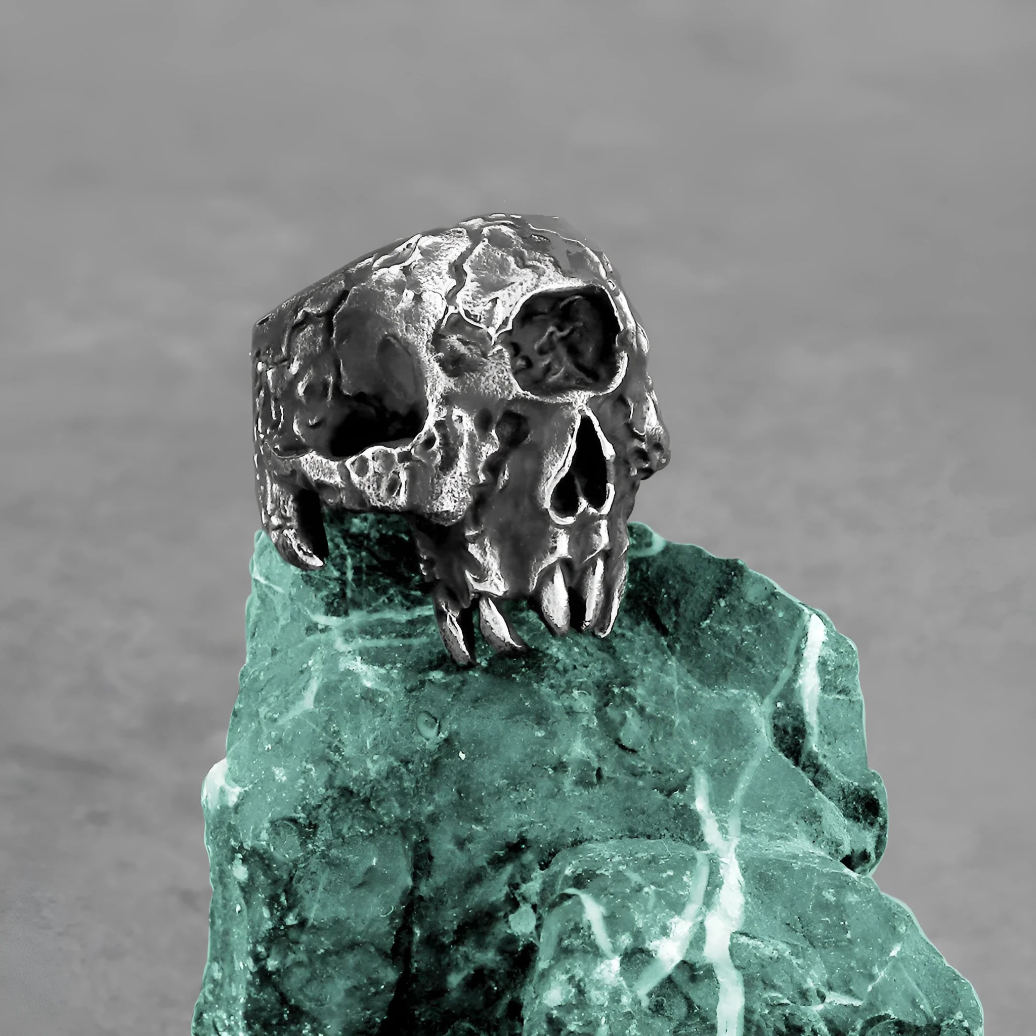 Retro punk alloy ring with a detailed one-eyed skull design and electroplated finish.
