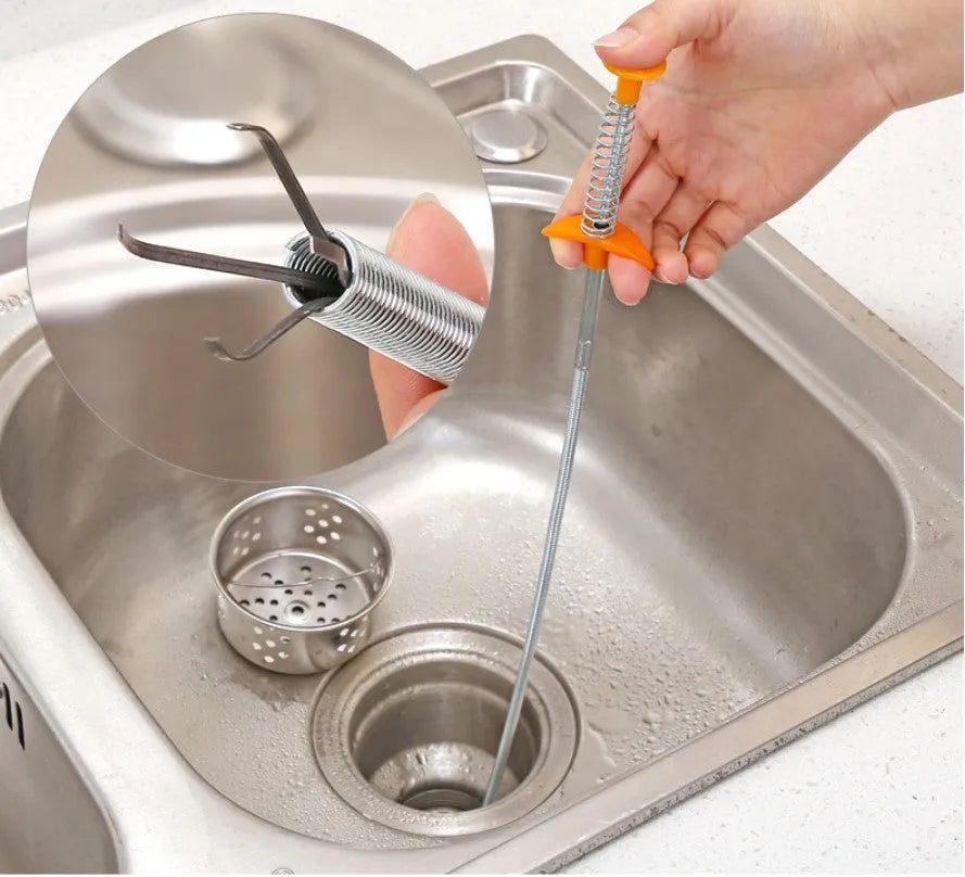 Black flexible sewer dredger spring drain cleaning tool with a textured grip on a white background.