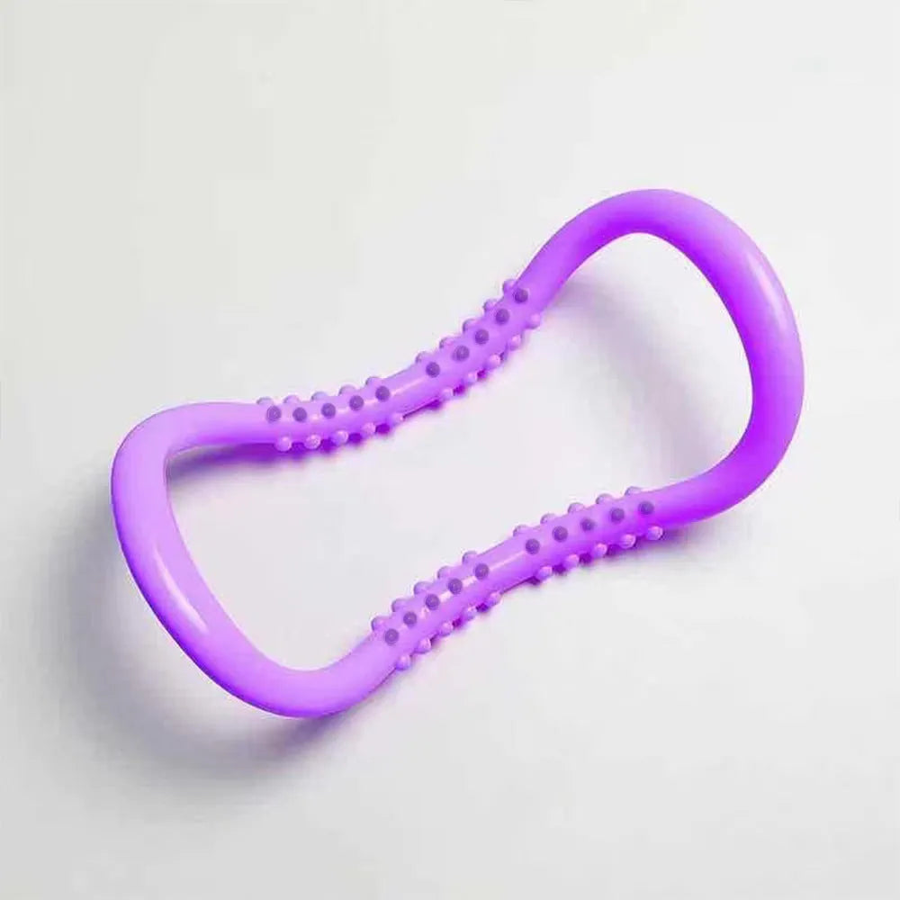 A purple, blue, or pink PP plastic yoga ring used for stretching and back opening exercises.