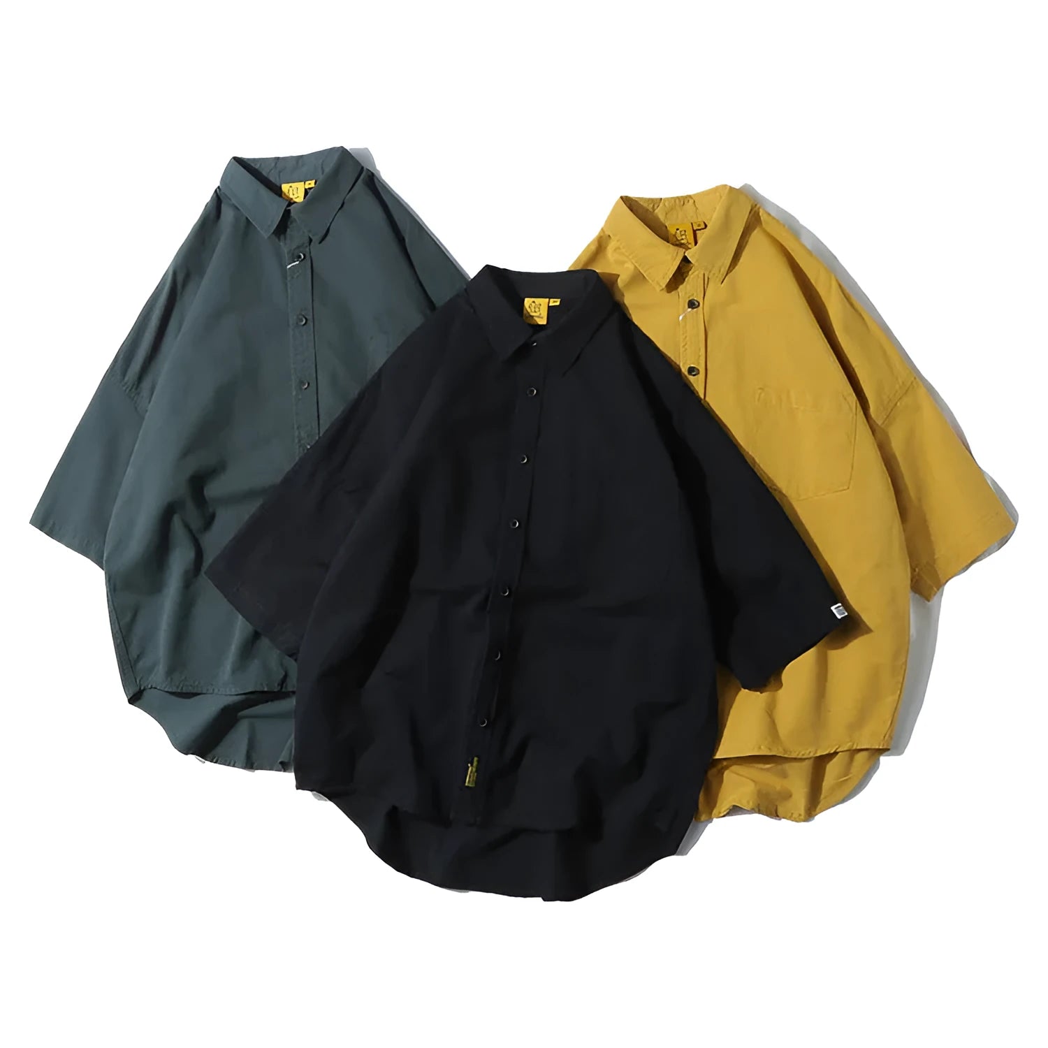 Men's loose fit Japanese cardigan shirt in a solid colour, shown in a summer setting.