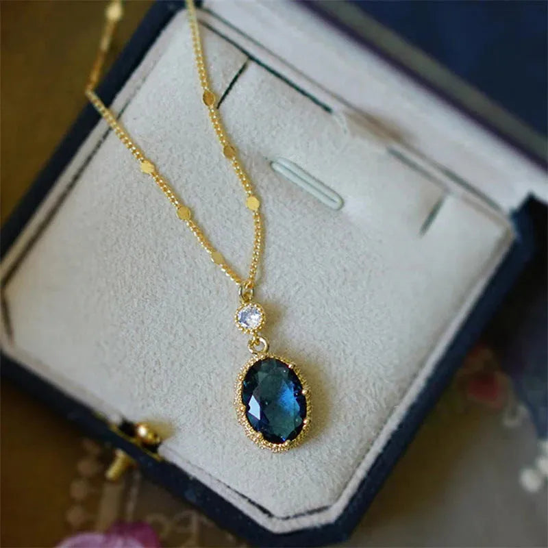Gold geometric pendant on a French retro style copper chain necklace.