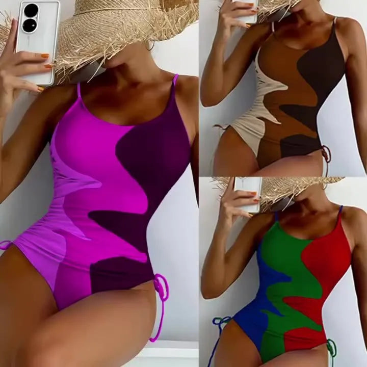 Women's sleeveless one-piece swimsuit in blue, shown from the front, with a backless design and striped pattern.