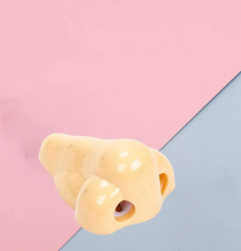 Flesh colour plastic pencil sharpener with large nostril design measuring 58x45x30mm