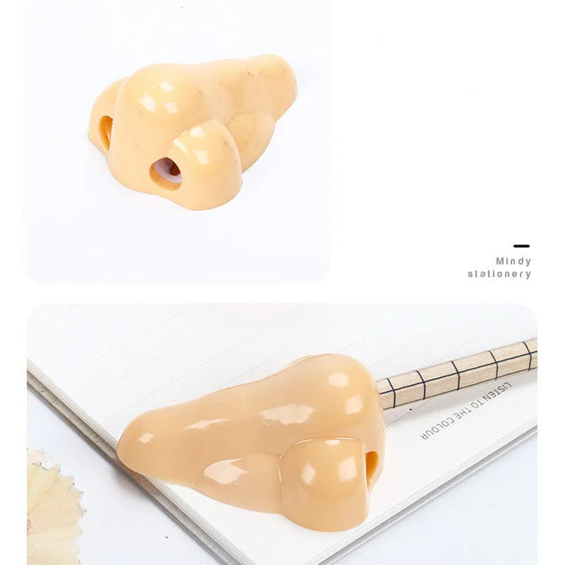 Flesh colour plastic pencil sharpener with large nostril design measuring 58x45x30mm