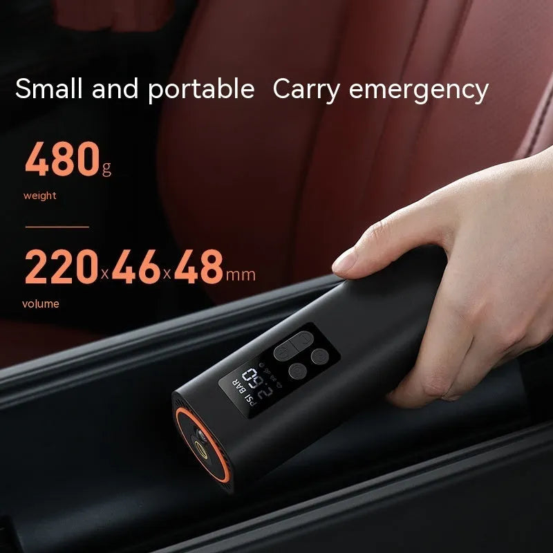 Black digital car tyre inflator with LCD display showing pressure readings