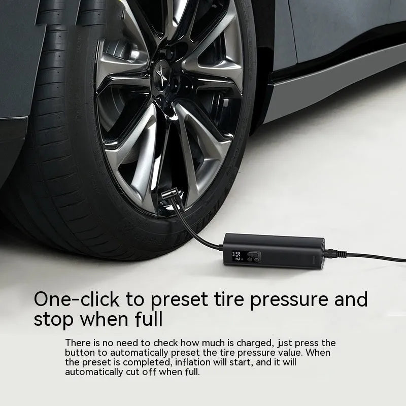 Black digital car tyre inflator with LCD display showing pressure readings