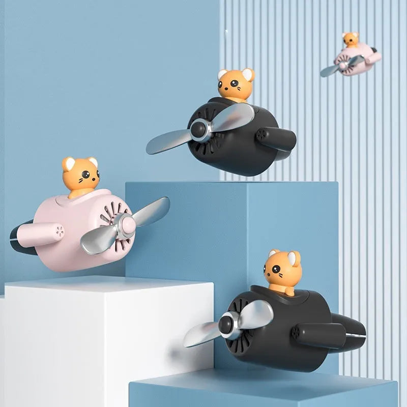 Cartoon aeroplane-shaped car air vent clip-on aromatherapy diffuser in chosen colour with fragrance pads.