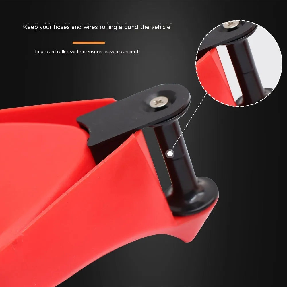Set of four red triangular plastic car parking blocks or wheel stops on a grey background.