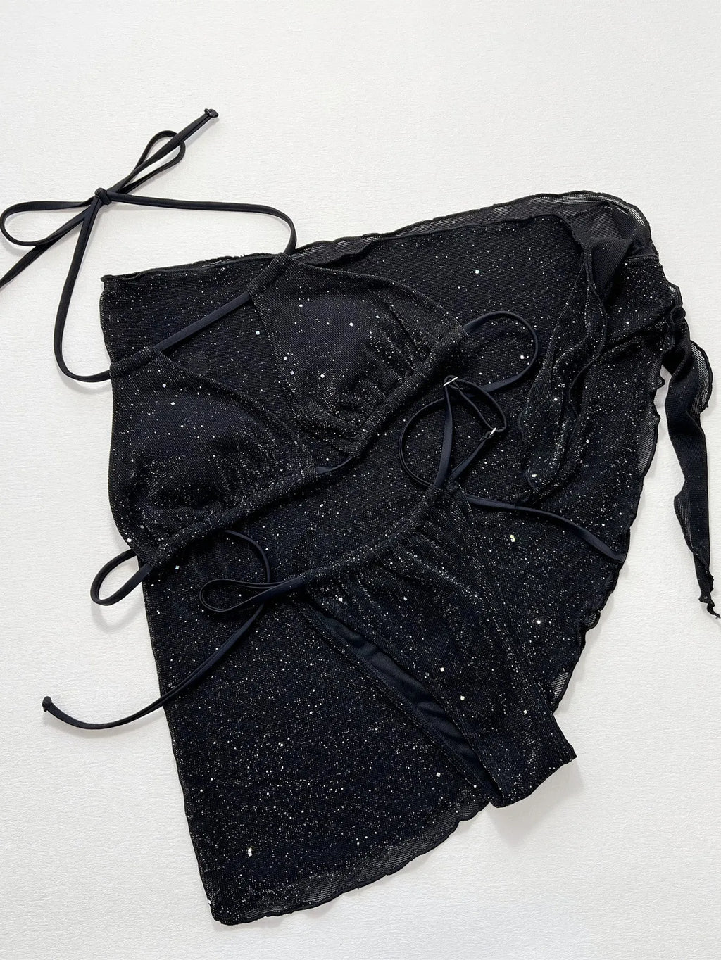 Black women's three-piece bikini swimsuit set with halterneck top and shorts on a mannequin.