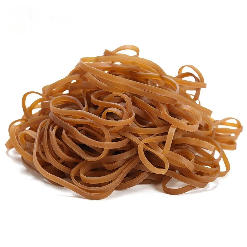 A pile of natural-coloured, round rubber rings next to a 500g bag.