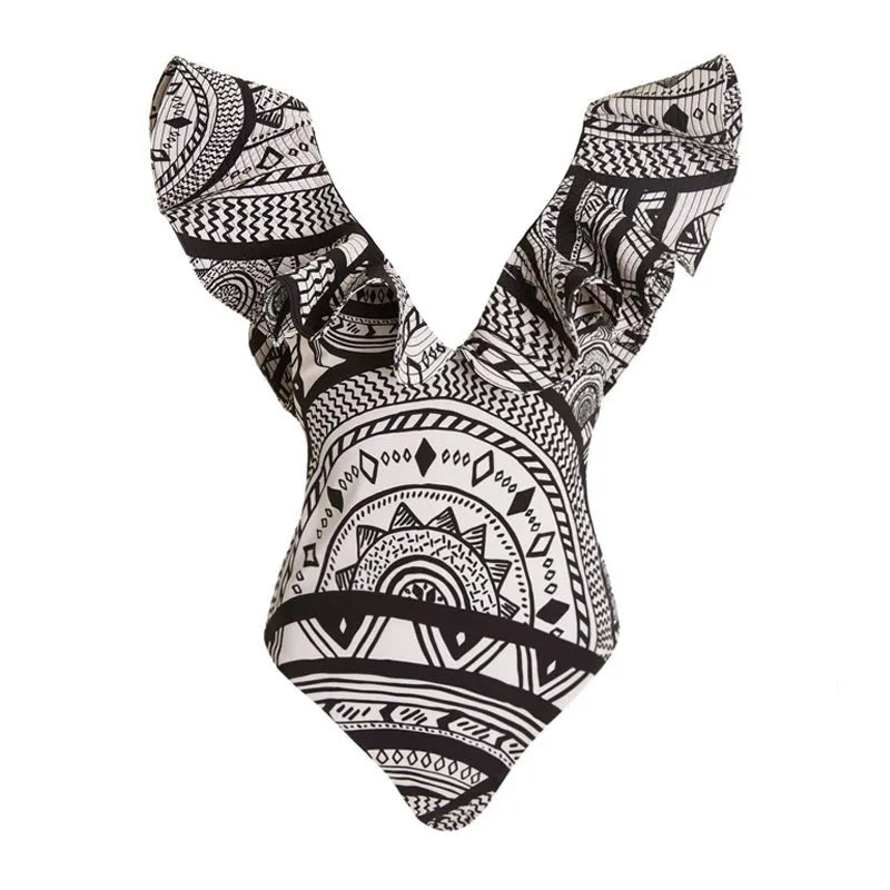 Women's deep V-neck one-piece swimsuit with vintage floral print and matching black wrap skirt.