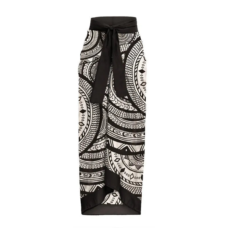 Women's deep V-neck one-piece swimsuit with vintage floral print and matching black wrap skirt.