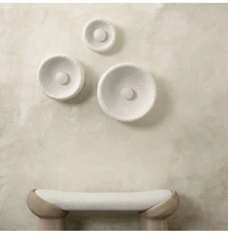Japanese-style modern wall lamp with white resin shade in three size options.